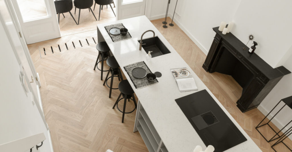 large kitchen with central island and hob