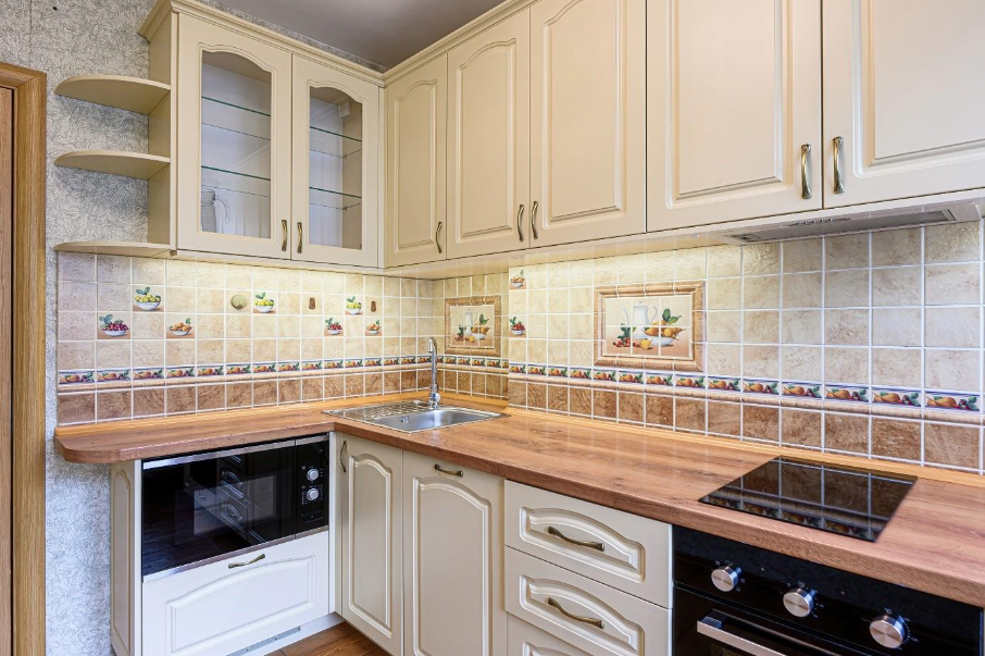 Integrated&nbsp;cabinet lighting in the kitchen under the cabinets frames the kitchen